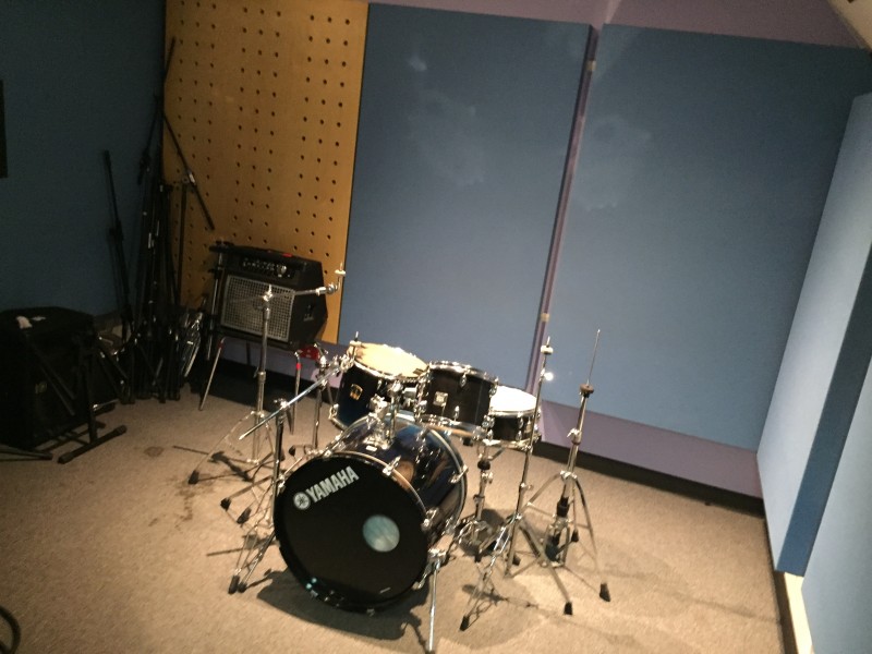 Music rehearsal studio with music instruments.