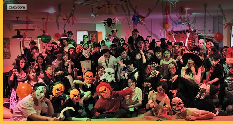 A groups of students with lecturer celebrate Halloween with quirky outfit